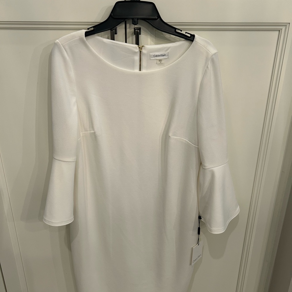 Calvin Klein Ivory Dress with three quarter length Sleeves.